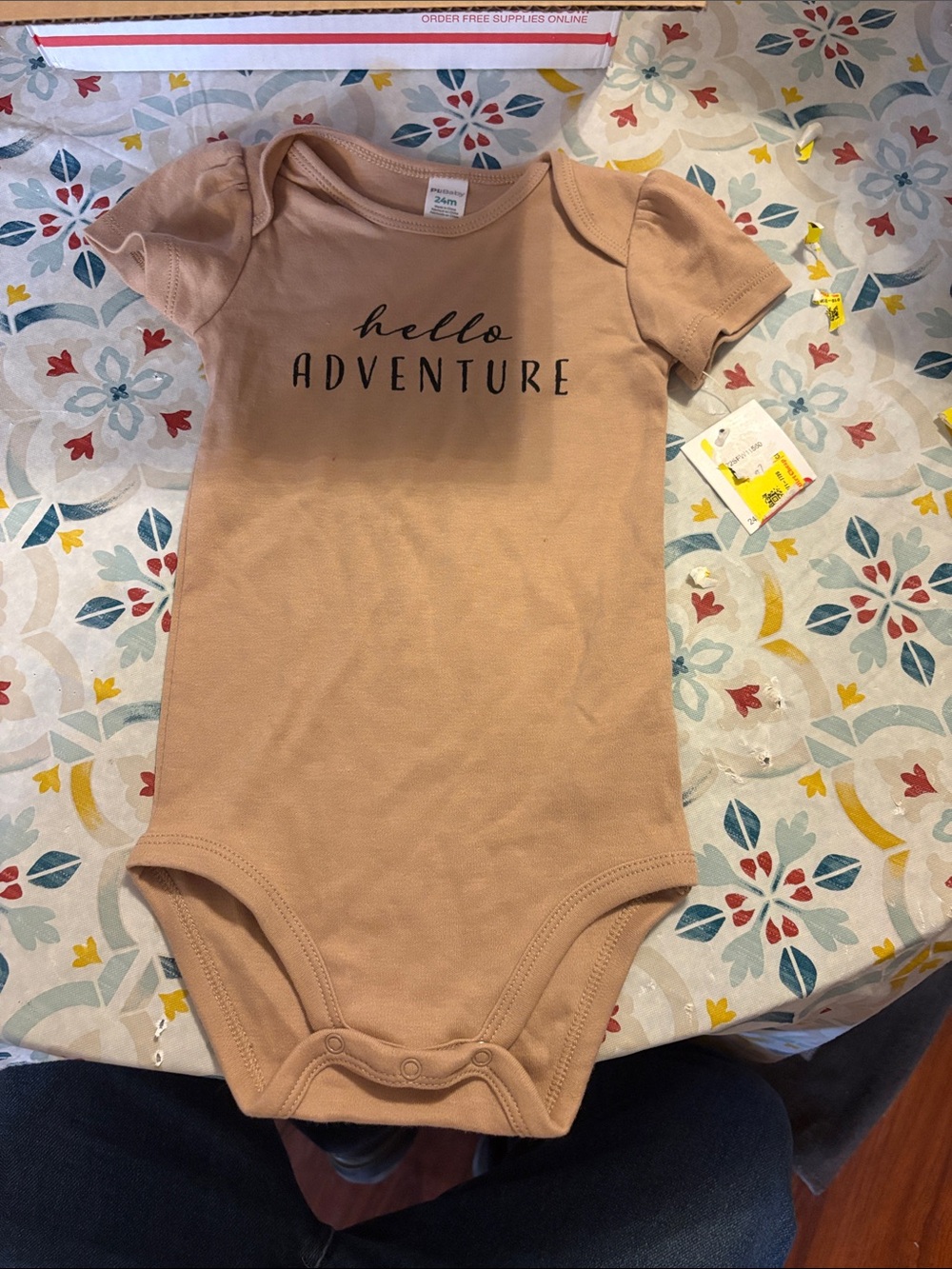 Tan Baby One-Piece Bodysuit with "hello ADVENTURE" Print
